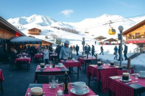 A panoramic, photorealistic winter scene of a bustling ski resort in the German Alps, shot in 16:9 format. In the foreground, a neatly set outdoor dining terrace of a mountain restaurant features empty tables with red-checkered cloths, steaming coffee cups, and lit candles, suggesting a peak season atmosphere. The background shows snow-covered slopes, a ski lift, and guests in winter gear arriving and departing. The lighting is soft natural daylight with clear blue sky, emphasizing a dynamic yet inviting hospitality environment. No text, logos, or visible faces are present. The image conveys the high demand for service staff in seasonal tourism.